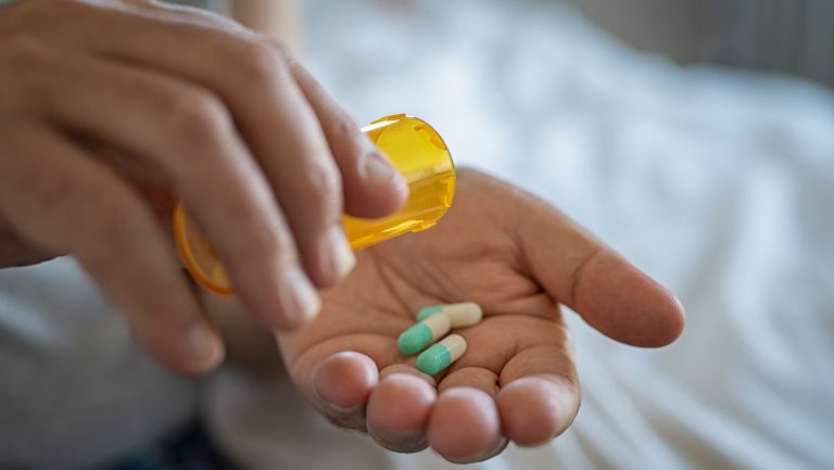 Man taking medicine